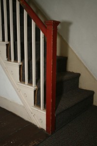 Stair hall. The Period III staircase is a reserved representation of a typical Federal style stair. The overall design is more characteristic of what is commonly found in country or rural areas.