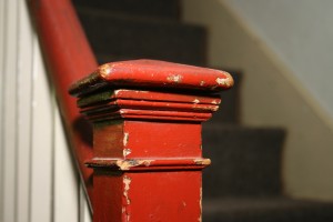 Stair hall. Detail of newell post. The general form of the staircase is rather simple: a straight run with a quarter turn at the top. It is the details applied to the stair that reveal its style, such as these delicate cymas and astragals.