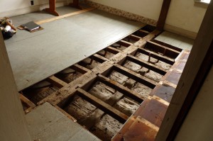 Room 202. The smoke stained floor joists are Period 1 material.