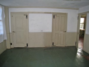 Room 102, Old Kitchen. The one over-one- panel door on the left is believed to date to the Period 1 house and has been retained in its original location.