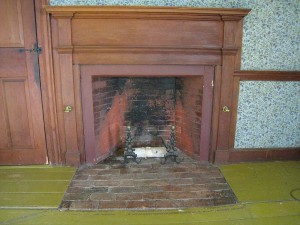 Room 209. The mantel here is a classic example of a typical Federal style mantel, more common to country and rural areas than urban. The woodwork has had only one coat of paint applied to it.
