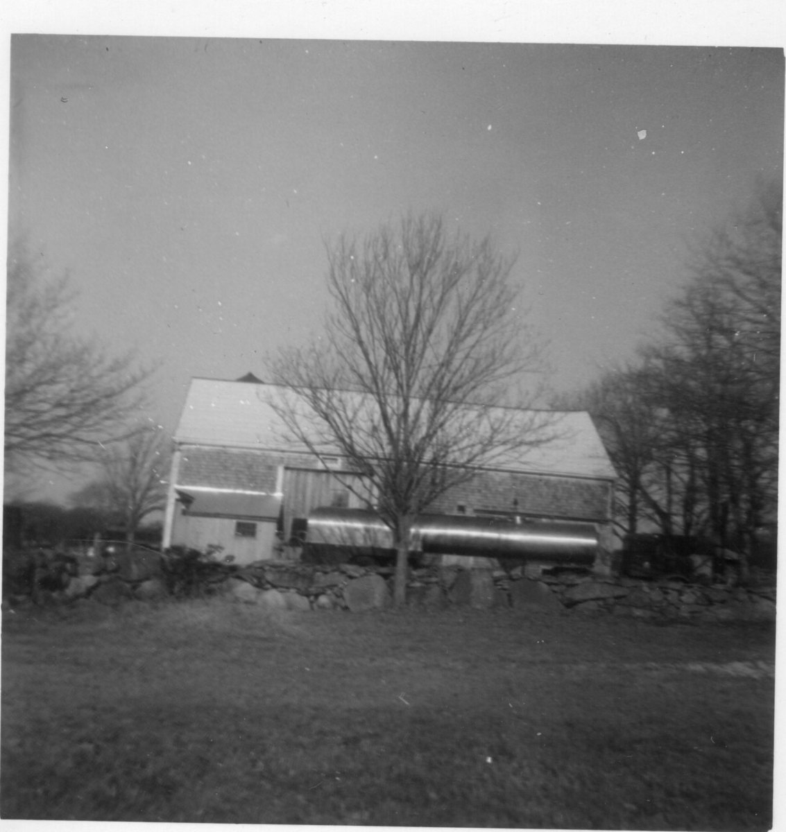 Milk-tanker-truck-picking-up-milk-1960s
